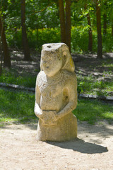 Ancient statue of a Polovtsian stone woman or boundary stone in the spring garden Biosphere Reserve “Askania Nova”, Ukraine.