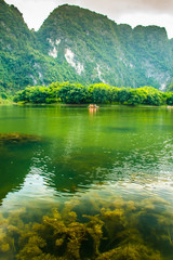 Lake reflection with mountains of Trang An Scenic Landscape, Ninh Binh in Vietnam