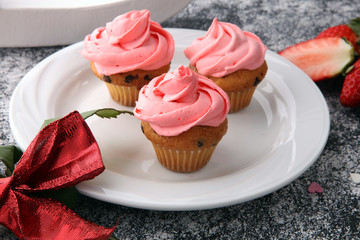 Delicious cupcake for Valentine Day. cake for Valentines day with chocolate and strawberries. Traditional homemade with red roses