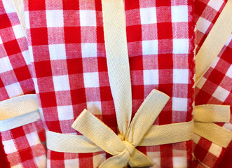 Close-up of red and white checkered table cloth