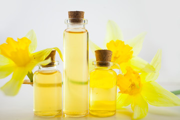 Essence of flowers  on white in beautiful glass jar