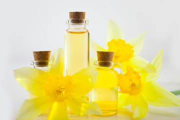 Essence of flowers  on white in beautiful glass jar