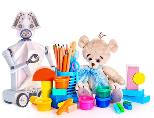 Obraz premium Robot toy and stuffed animals teddy bear and color pencils and cans of paint. White plastic device for children on isolated.