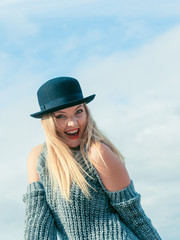 Woman wearing fedora and jumper outdoor