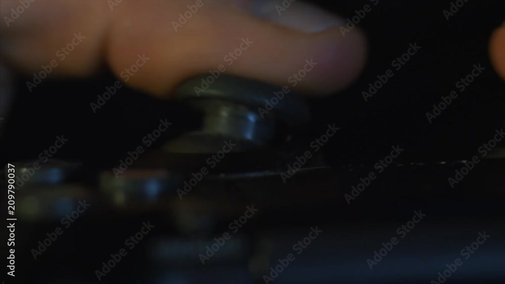 Poster man hands holding a gamepad close-up. macro of man fingers is playing game console with joystick
