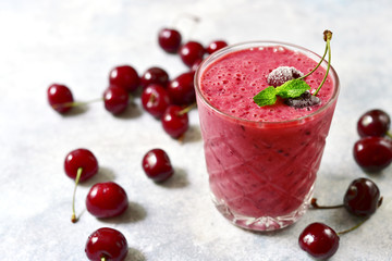Cherry banana smoothie in a glass.
