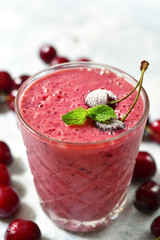 Cherry banana smoothie in a glass.