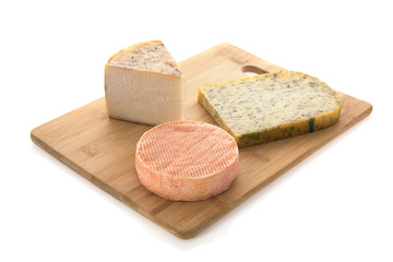 Cheese as snack on cutting board