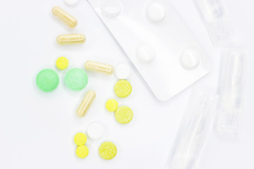 Different pills on white background. Texture for text.