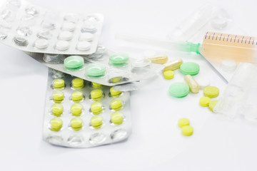 Many different medicines on a light background.