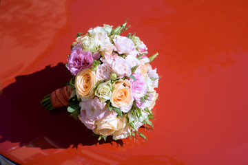 Beautiful wedding colorful bouquet and car for bride