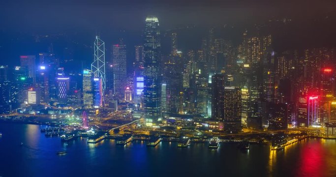 Aerial timelapse of illuminated Hong Kong skyline. Hong Kong, China