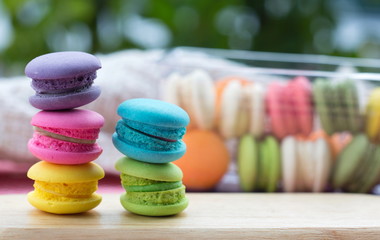 Pile of french colorful macarons on table.