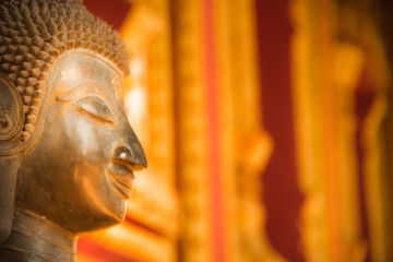blurred image of face buddha statue at hor phra kaew vientiane laos capital