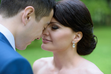 Fototapeta premium Wedding couple on the nature is hugging each other