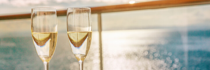 Luxury cruise ship travel champagne glasses on balcony deck with ocean sunset view on Caribbean...