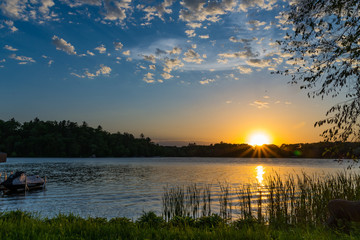 Summer sunset over lake in Minnesota - obrazy, fototapety, plakaty