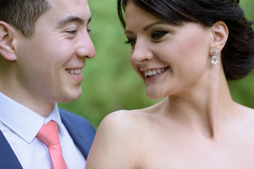 Wedding couple on the nature is hugging each other