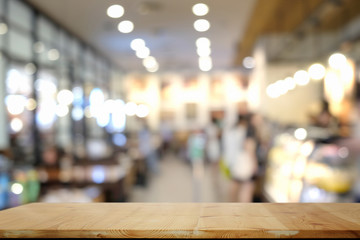 Empty wooden table in cafe for product display montage.
