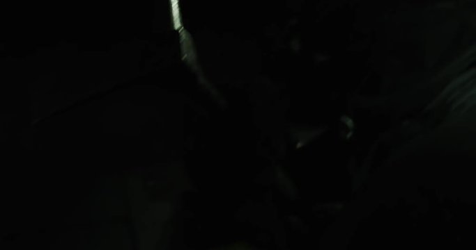 Firefighter breaking door with axe