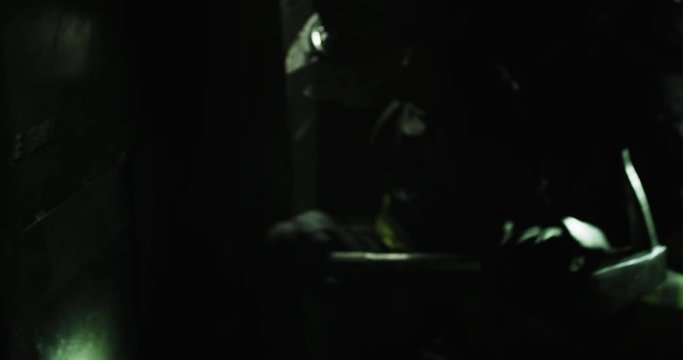 Firefighter breaking down door with axe