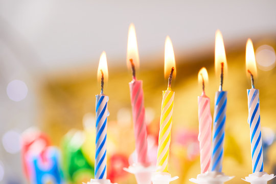 birthday candles on golden background
