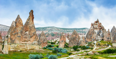 Naklejka premium Wonderful landscape with ancient church at Cappadocia, Anatolia, Turkey. Volcanic mountains in Goreme national park.