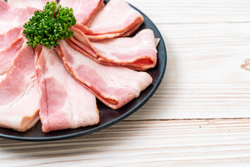 sliced raw pork bacon