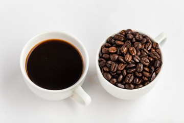 Coffee and coffee beans in white cups, white background