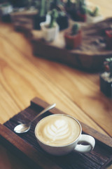 Cup of coffee latte in coffee shop