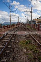 Fototapeta na wymiar Railroad tracks leading away