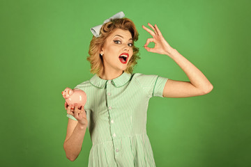 Fototapeta premium accounting of funds. Sensual girl save money for future.