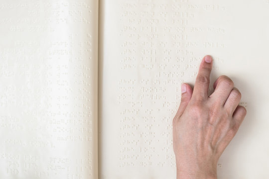 Braille Book For Low Vision/ Blind Person Reading Braille Sign By Finger Touching Embossed Texture Paper For World Sight Day And World Braille Day Awareness Concept