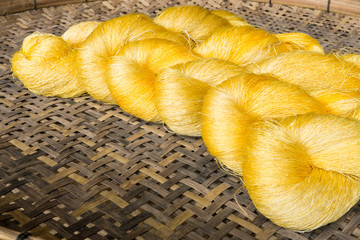 The yellow silks have not been bleached on  bamboo basket