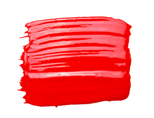 Red acrylic paint brush isolated on white background
