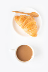 Coffee and croissant on white background