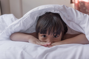 Fototapeta na wymiar health and beauty concept - little girl sleeping at home