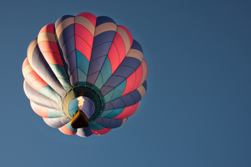 Hot Air Balloon, Flying in a Clear, Blue Sky, Firing Off the Burners to Gain Elevation © DGC
