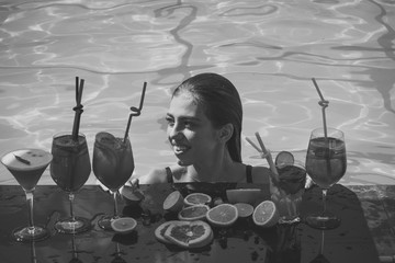 cocktail party. Cocktail and sexy girl in pool.