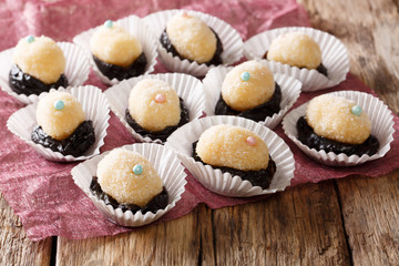Festive brazilian sweets Olho de sogra with prunes close-up. horizontal