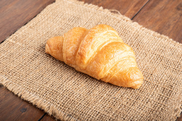 croissant on wooden background