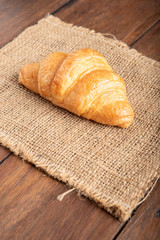 croissant on wooden background