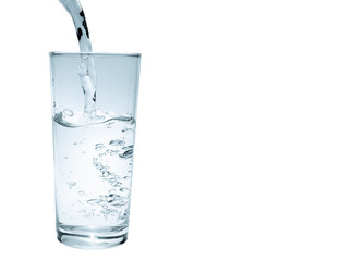 water to drink poured into a glass on a white background,clipping path included
