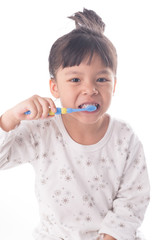 Little girl brushing her teeth isolated on white background