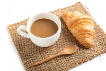 Coffee and croissant on white background