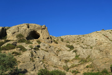 Image of a cave in a rock.