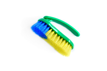 Green cleaning brush isolated on white background.