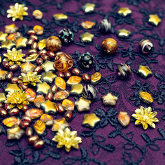 Embroidery fabric. To embroider beading dress. Considering the materials for creativity close. The creation of jewelry. Stylish ideas.