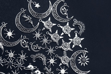 Charm pendants for crafting. Sun and moon symbols. Star and planet figures.
