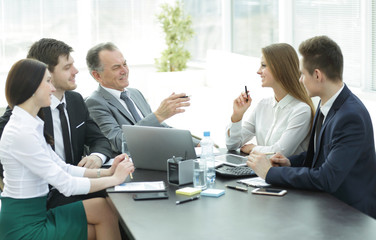 business colleagues talking at Desk in the office